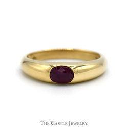 Bezel Set Oval Ruby Solitaire Ring in Polished 14k Yellow Gold