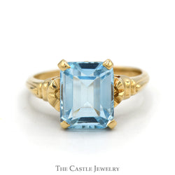 Emerald Cut Blue Topaz Ring with Textured Sides in 10k Yellow Gold