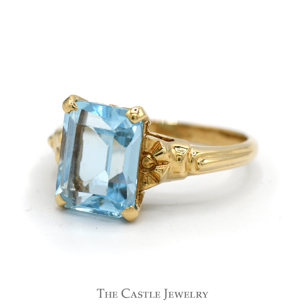 Emerald Cut Blue Topaz Ring with Textured Sides in 10k Yellow Gold