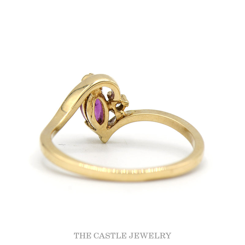 Marquise Ruby Solitaire Ring with Diamond Accent in 10k Yellow Gold Swirled Bypass Mounting