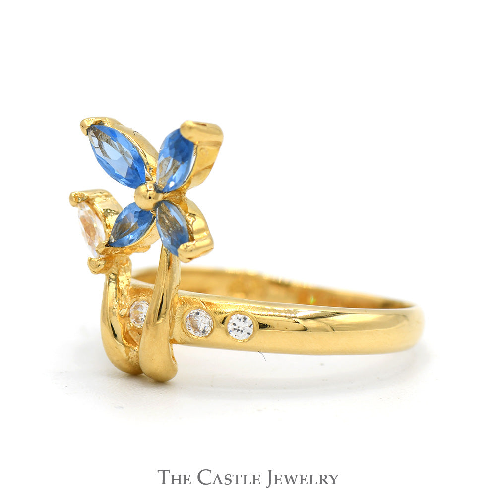 Marquise Cut Blue Topaz Flower Ring with Cubic Zirconia Accents in 18k Yellow Gold