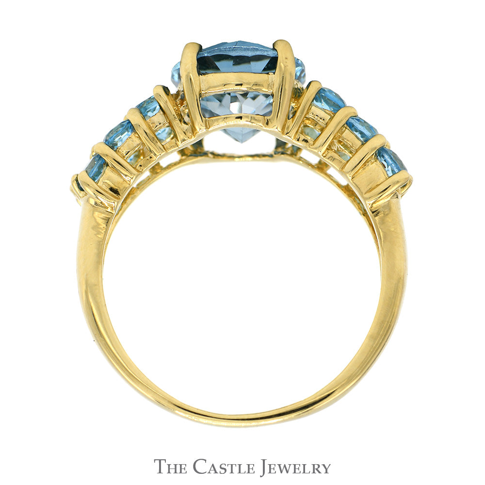 Oval Cut Blue Topaz Ring with Blue Topaz Cluster Sides in 14k Yellow Gold
