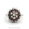 Domed starburst cluster ring with 12 rubies and 19 round diamonds, 1/2cttw, in 14k white gold — top view - Thumbnail 1