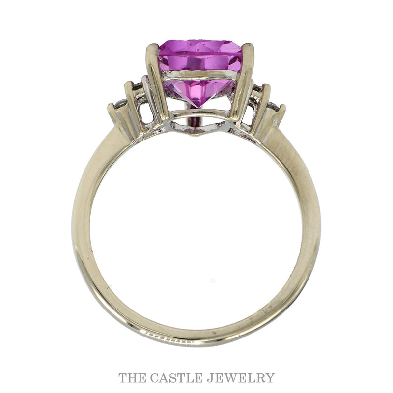 Front-facing view of the 10k white gold trillion pink sapphire ring