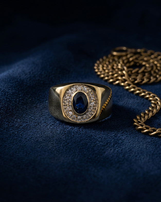 0.15ctw Oval Sapphire Ring with Diamond Bezel in 10k Yellow Gold