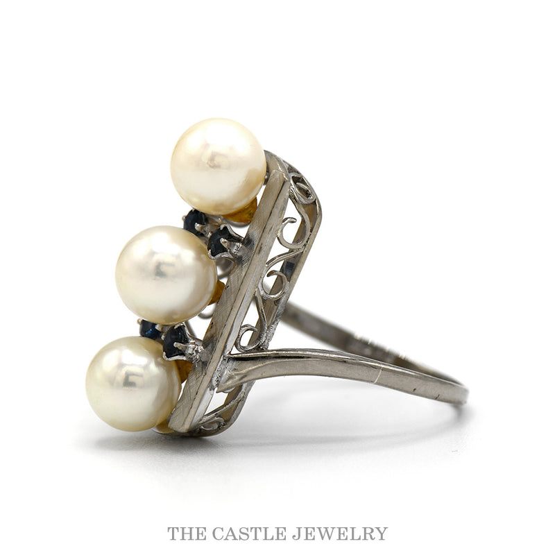 Side profile of the 14k white gold three pearl shield ring