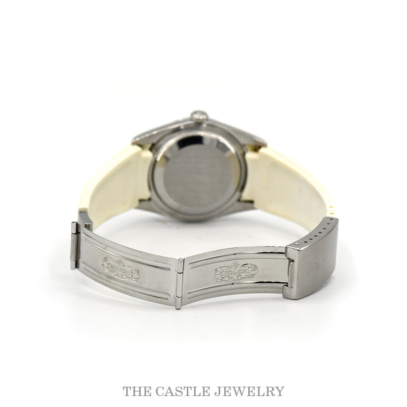 White rubber strap deployment buckle open — Rolex crown engravings
