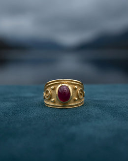 Wide Brushed Band Ring with Oval Cabochon Ruby and Scrolls in 14k Yellow Gold