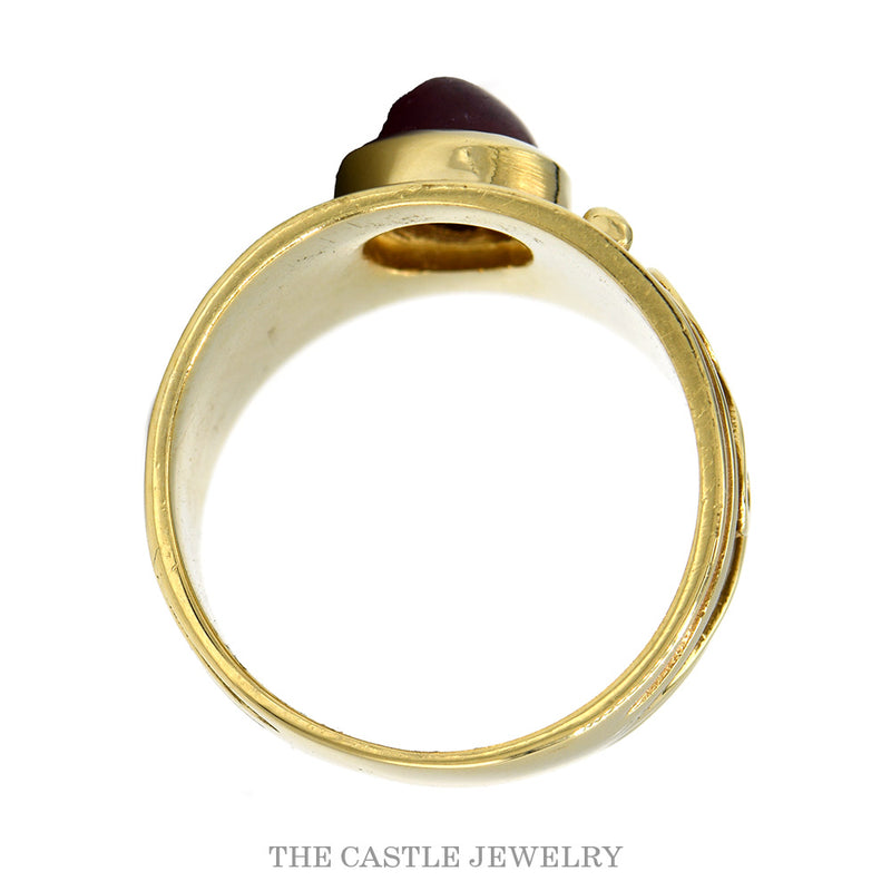 Front-facing view of the oval cabochon ruby band with polished scrolls and beads in 14k yellow gold