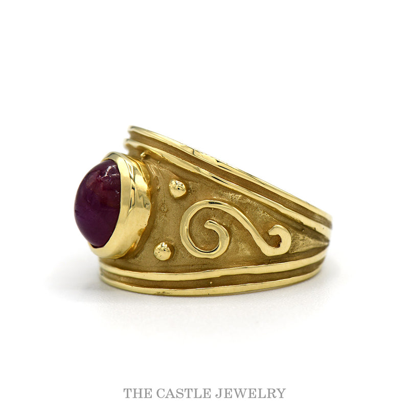 Side profile of the wide brushed 14k yellow gold cabochon ruby band