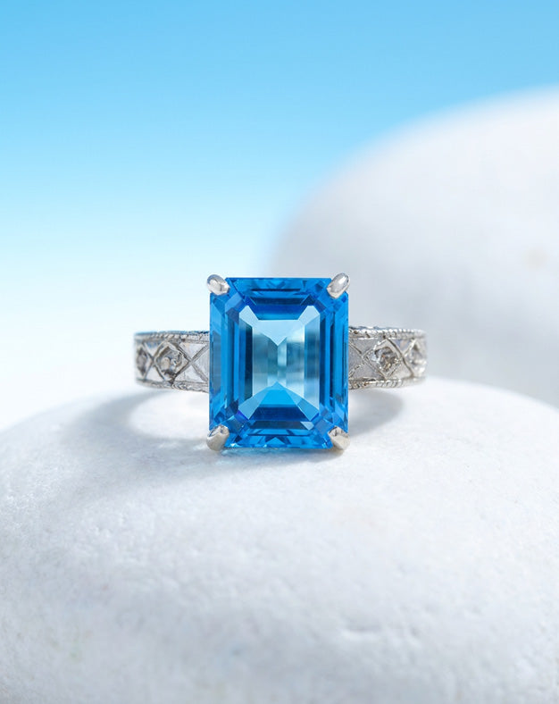 Emerald Cut Blue Topaz Ring with Engraved Diamond Accent Band in 14k White Gold