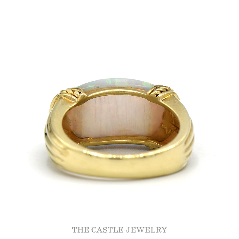 Front-facing view of the dome shaped opal ring in 10k yellow gold