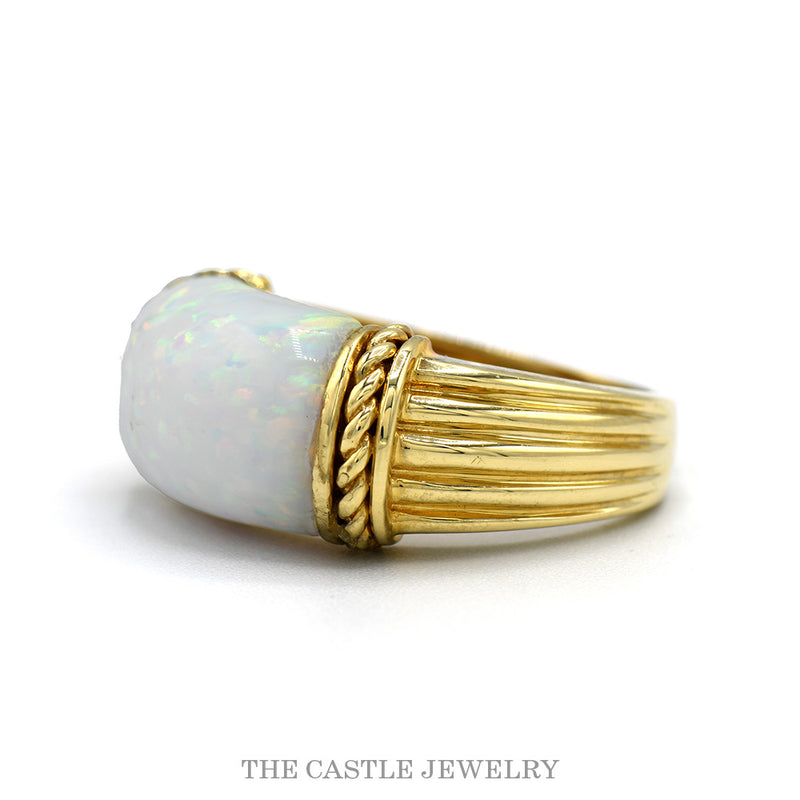 Side profile of the 10k yellow gold opal ring showing the fluted ridged shoulders