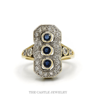 .38cttw diamond shield ring with three bezel-set sapphires in 10k two-tone gold — top view