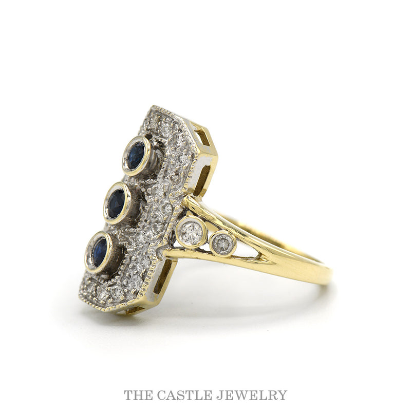 Side profile of the sapphire shield ring showing the plaque height and yellow gold shoulders
