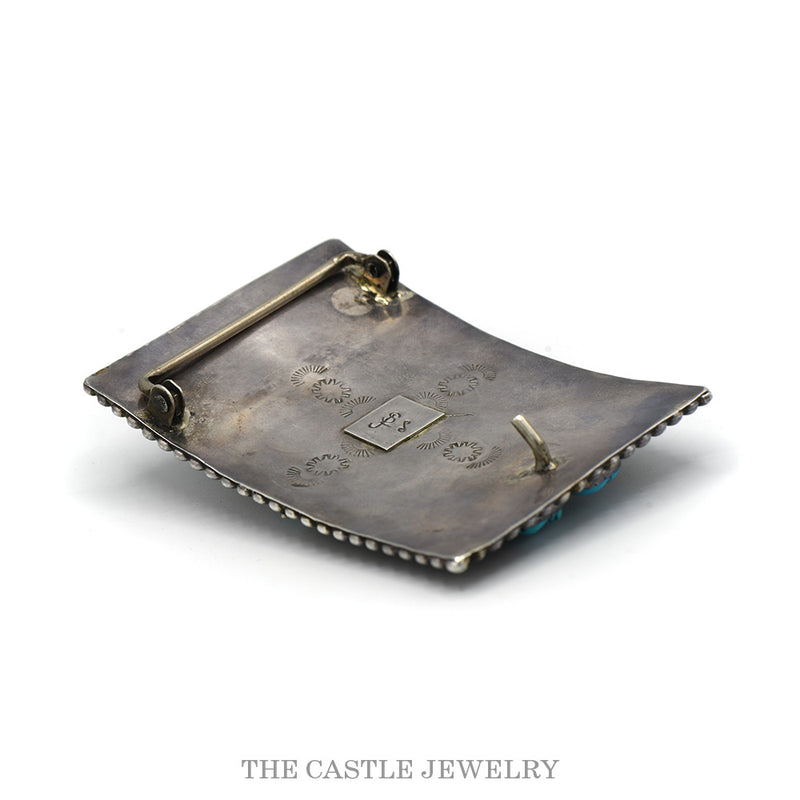 Angled view of the reverse of the sterling bear belt buckle showing the bar, hook and hallmark