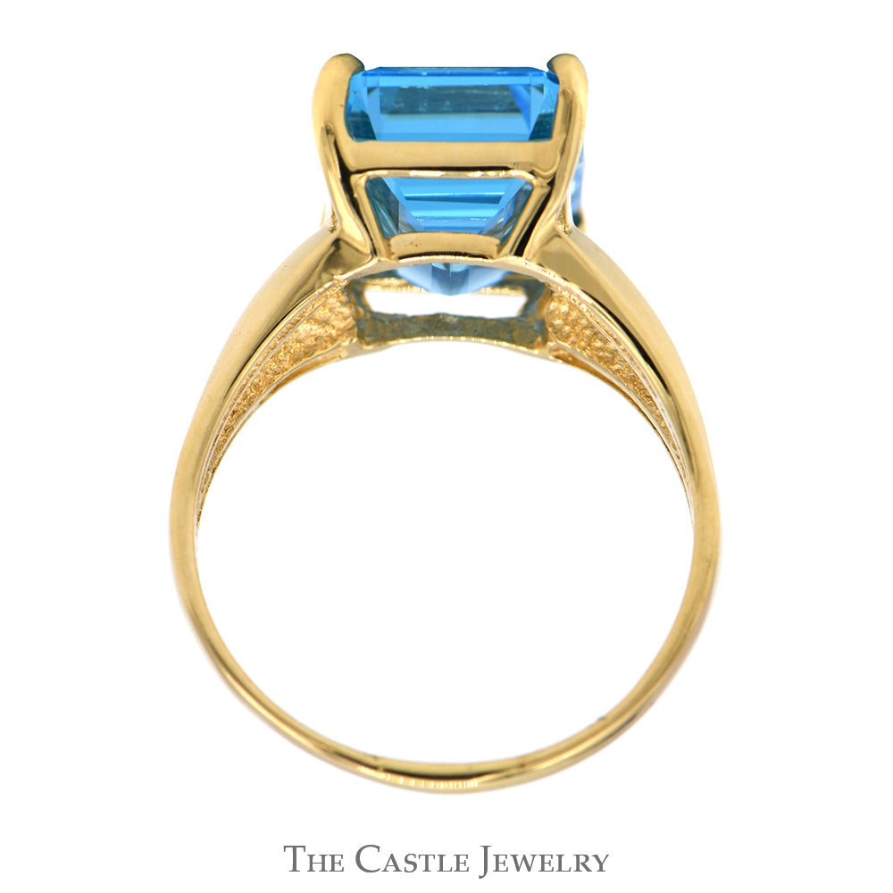 Emerald Cut Blue Topaz Ring with Polished Tapered Sides in 10k Yellow Gold