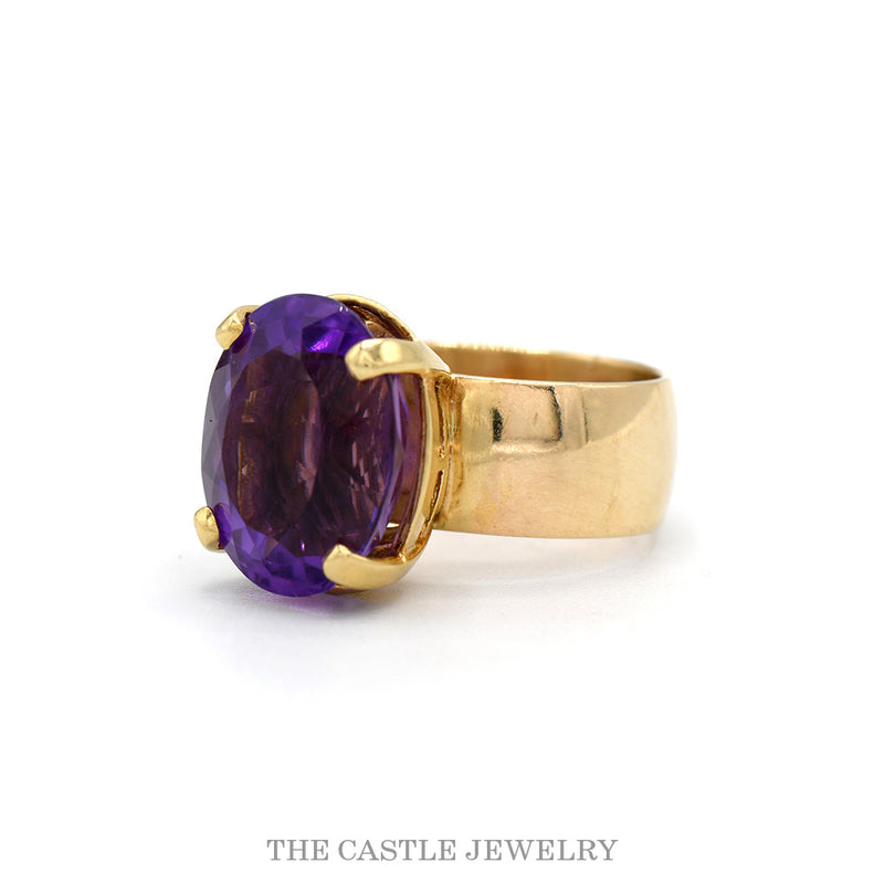 Side profile of the 14k yellow gold oval amethyst ring showing the 8mm band