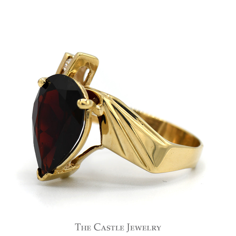 Pear Cut Garnet Ring with White Sapphire Accents in 10k Yellow Gold Bypass Mounting