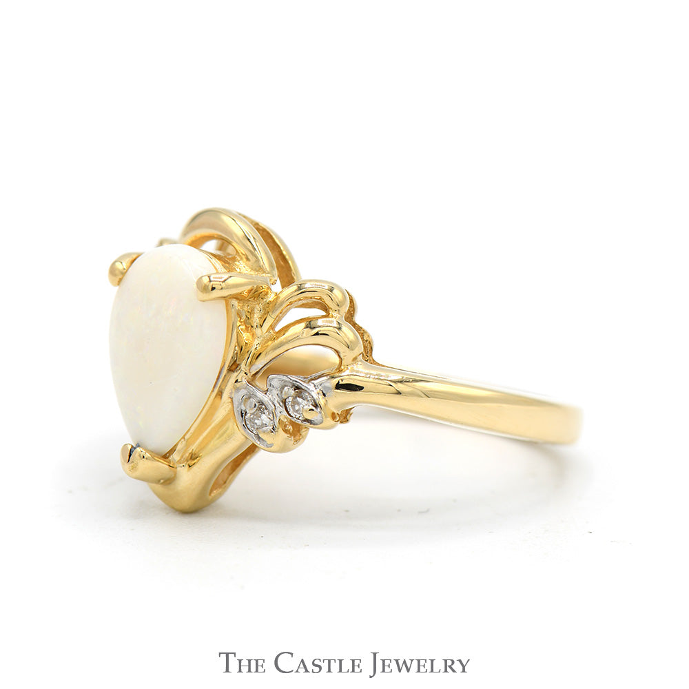 Pear Cut Opal Ring with Illusion Set Diamond Accented Sides in 14k Yellow Gold