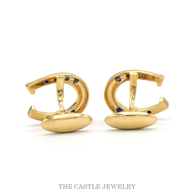 Front-facing view of the 14k yellow gold sapphire horseshoe cufflinks