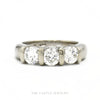 14k white gold three-stone tension-set round diamond band — top view - Thumbnail 1