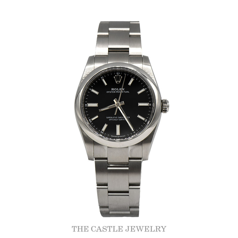 Rolex Oyster Perpetual 34mm 124200 with black dial on a stainless steel Oyster bracelet — angled view