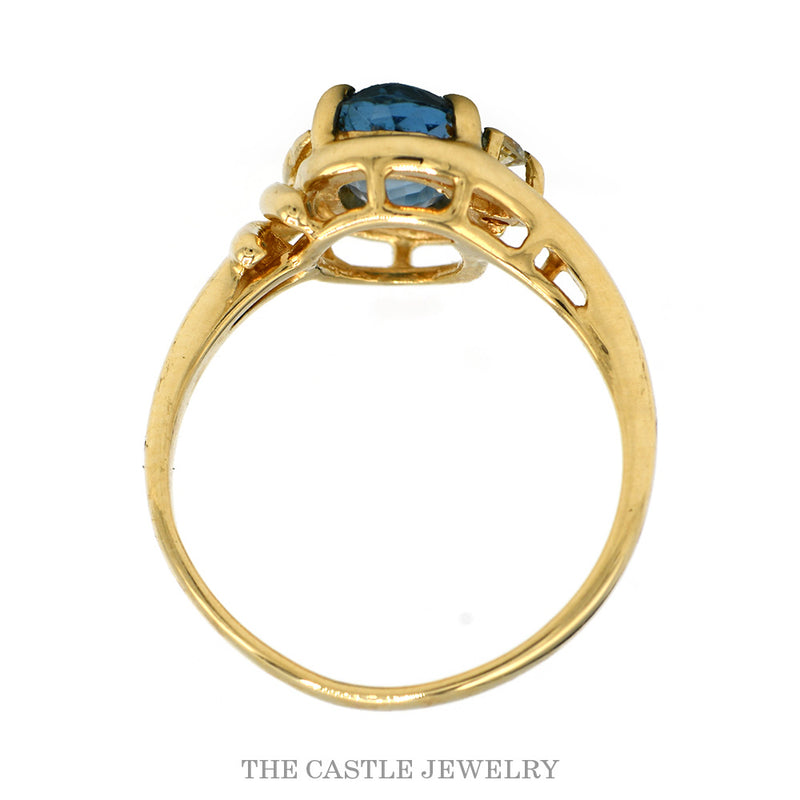 Front-facing view of the 14k yellow gold topaz bypass ring