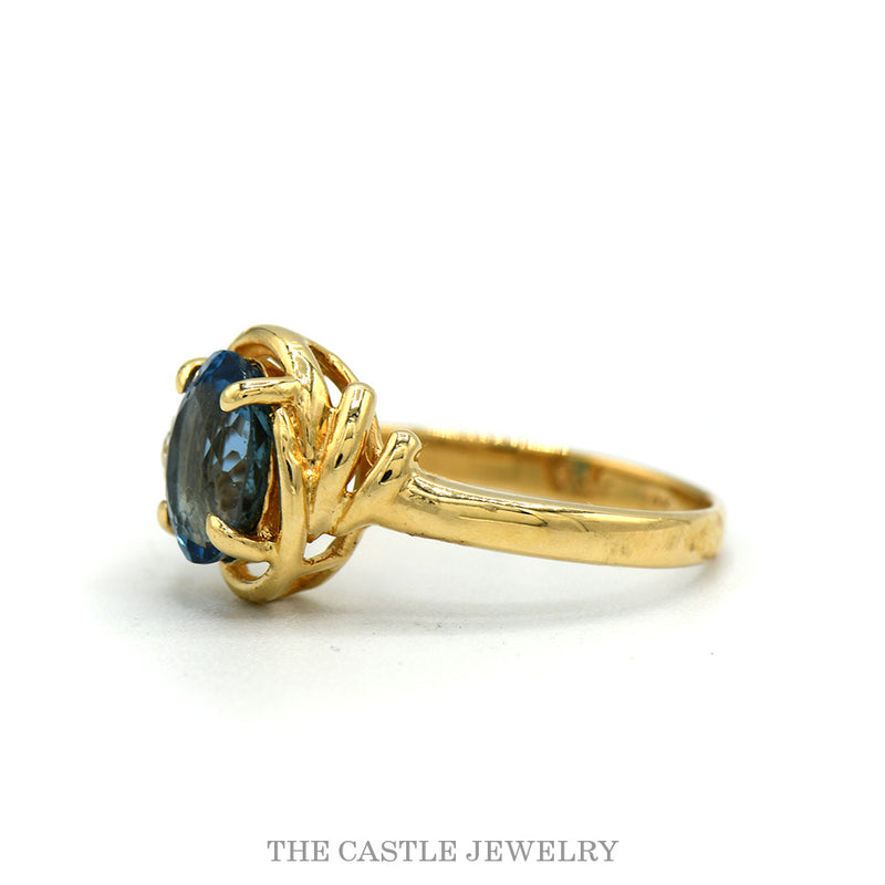 Side profile of the 14k yellow gold oval topaz ring