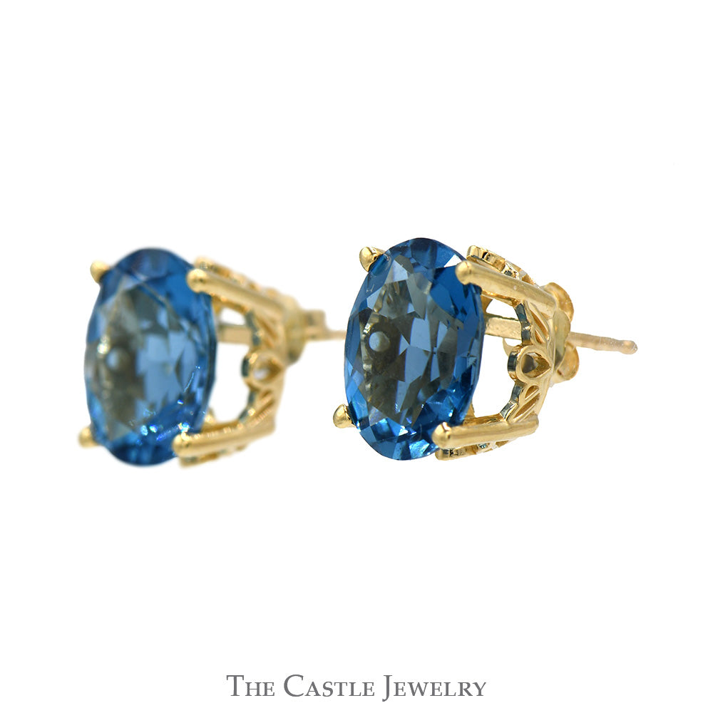 Oval Blue Topaz Studs in 14k Yellow Gold Basket Mounting