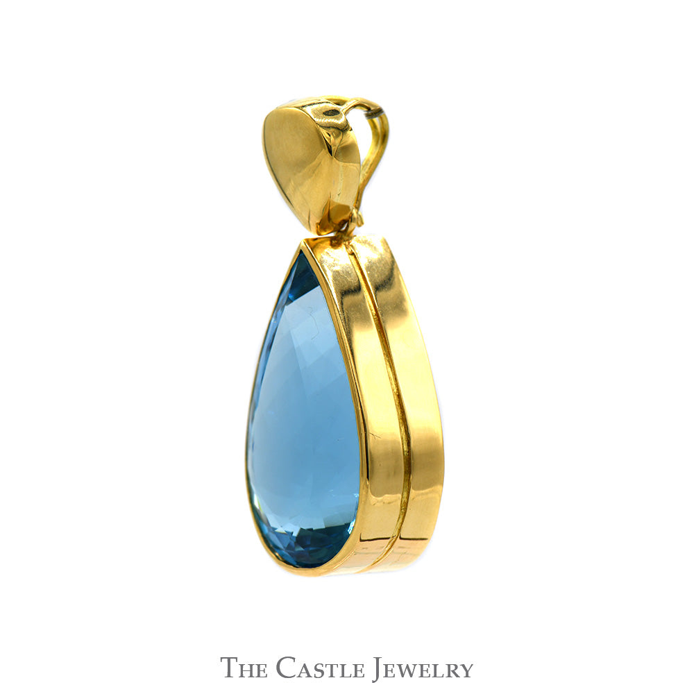 Large Bezel Set Pear Cut Blue Topaz Pendant in 10k Yellow Gold