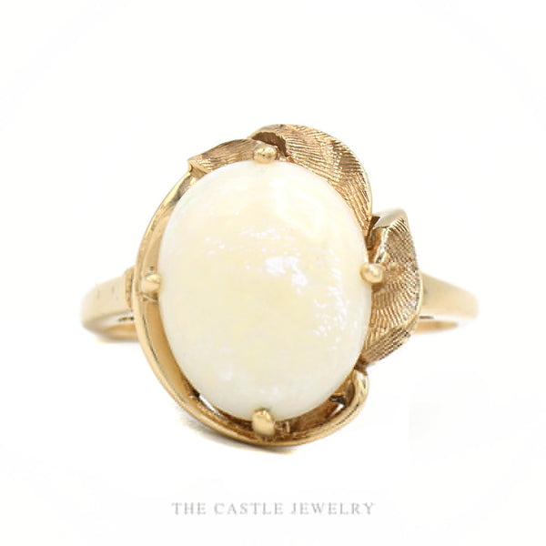 10k yellow gold oval white opal cabochon ring with leaf-style openwork frame — top view
