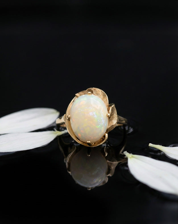 Oval White Opal Cabochon Ring with Leaf-Style Openwork Frame in 10k Yellow Gold