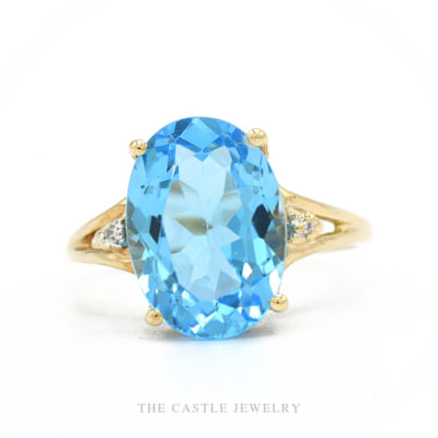 10k yellow gold oval blue topaz ring with illusion-set diamond split-shank shoulders — top view
