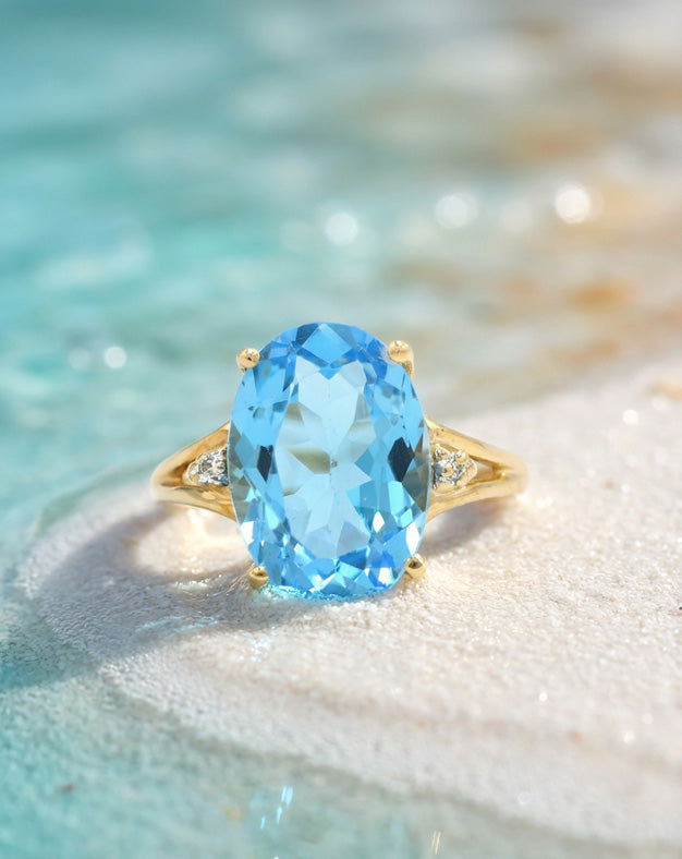 Oval Blue Topaz Ring with Illusion-Set Diamond Split-Shank Shoulders in 10k Yellow Gold