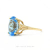 Side profile of the 10k yellow gold blue topaz ring showing setting height and split shank - Thumbnail 3