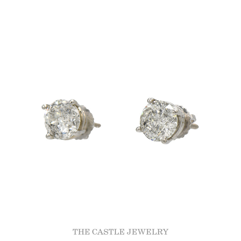 Side view of the salt and pepper diamond studs showing the four prong mounts