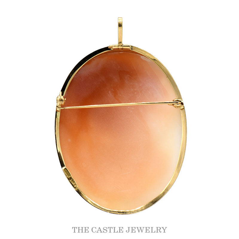 Reverse of the oval double cameo showing the hinged pin stem, catch and folding bail in 14k yellow gold
