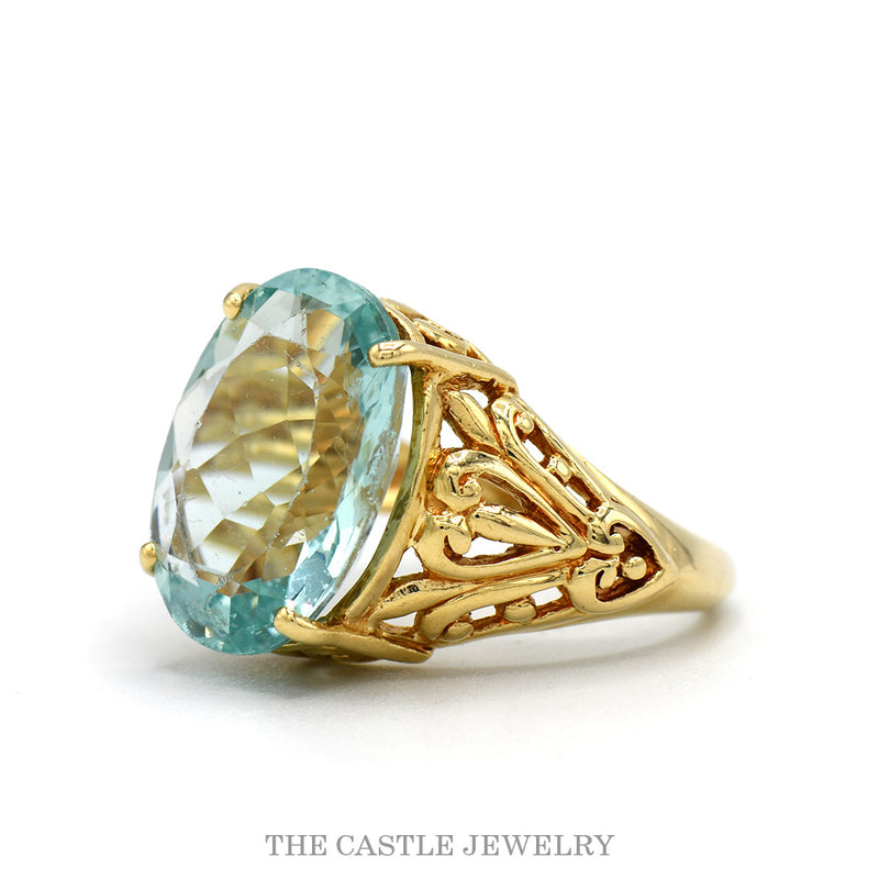 Side profile of the 10k yellow gold blue topaz filigree ring