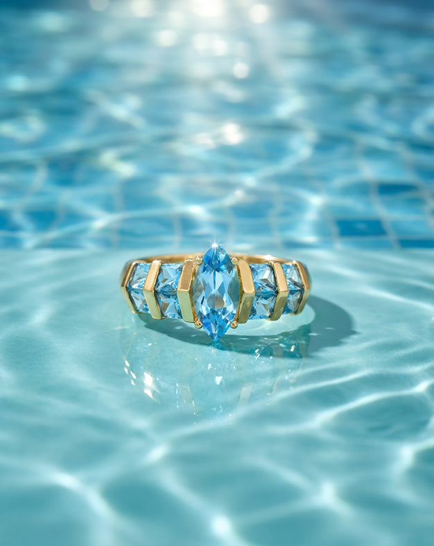 Marquise Blue Topaz Ring with Double Row Square Topaz Sides in 14k Yellow Gold