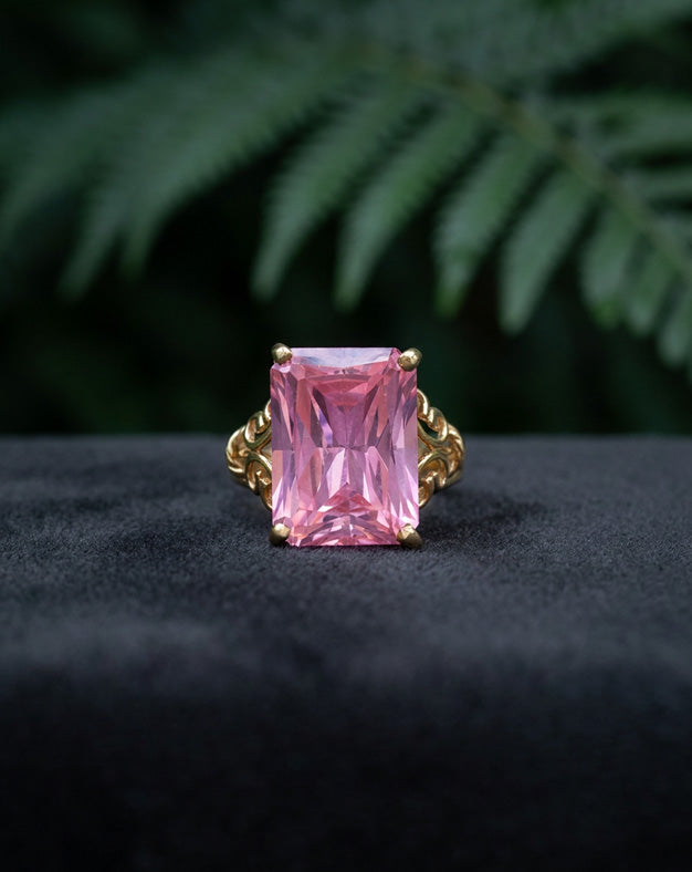 Emerald Cut Pink Ice Ring with Scroll Designed Sides in 10k Yellow Gold