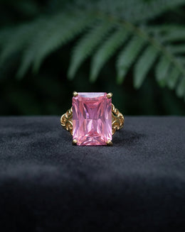 Emerald Cut Pink Ice Ring with Scroll Designed Sides in 10k Yellow Gold