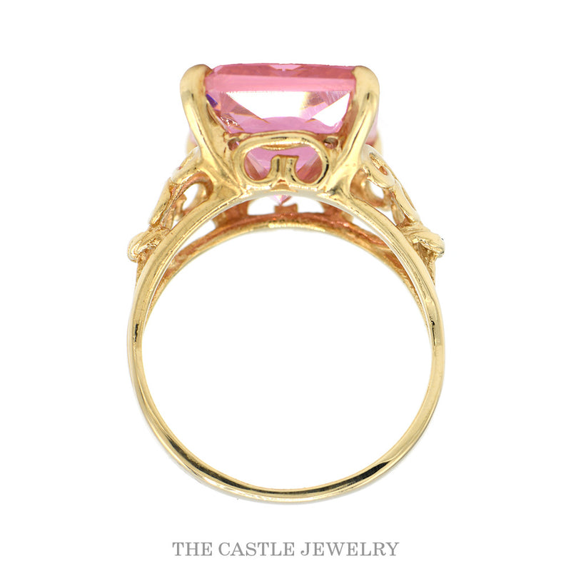 Front-facing view of the emerald cut pink ice ring with scroll designed sides in 10k yellow gold