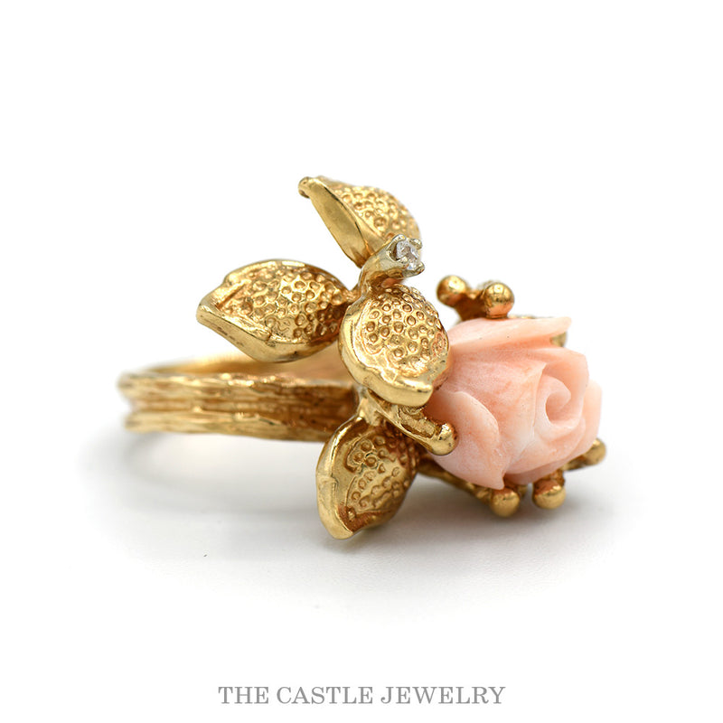 Side profile of the carved coral rose ring showing the bark textured shank