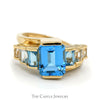 Emerald Cut Blue Topaz Ring with Graduated Design in 14k Yellow Gold Bypass Setting - Thumbnail 1