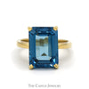Emerald Cut Blue Topaz Solitaire Ring in 14k Yellow Gold - Thumbnail 1