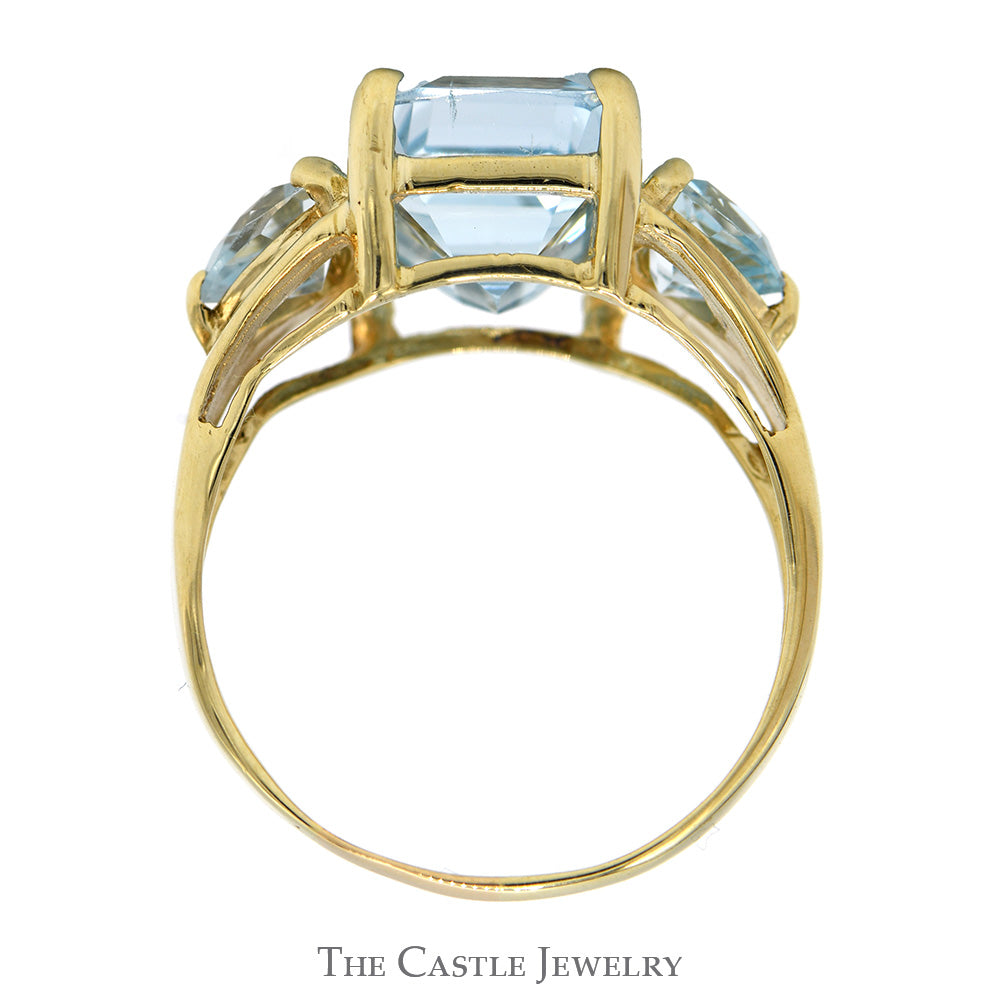 Emerald Cut Blue Topaz Ring with Trillion Cut Topaz Sides in 10k Yellow Gold