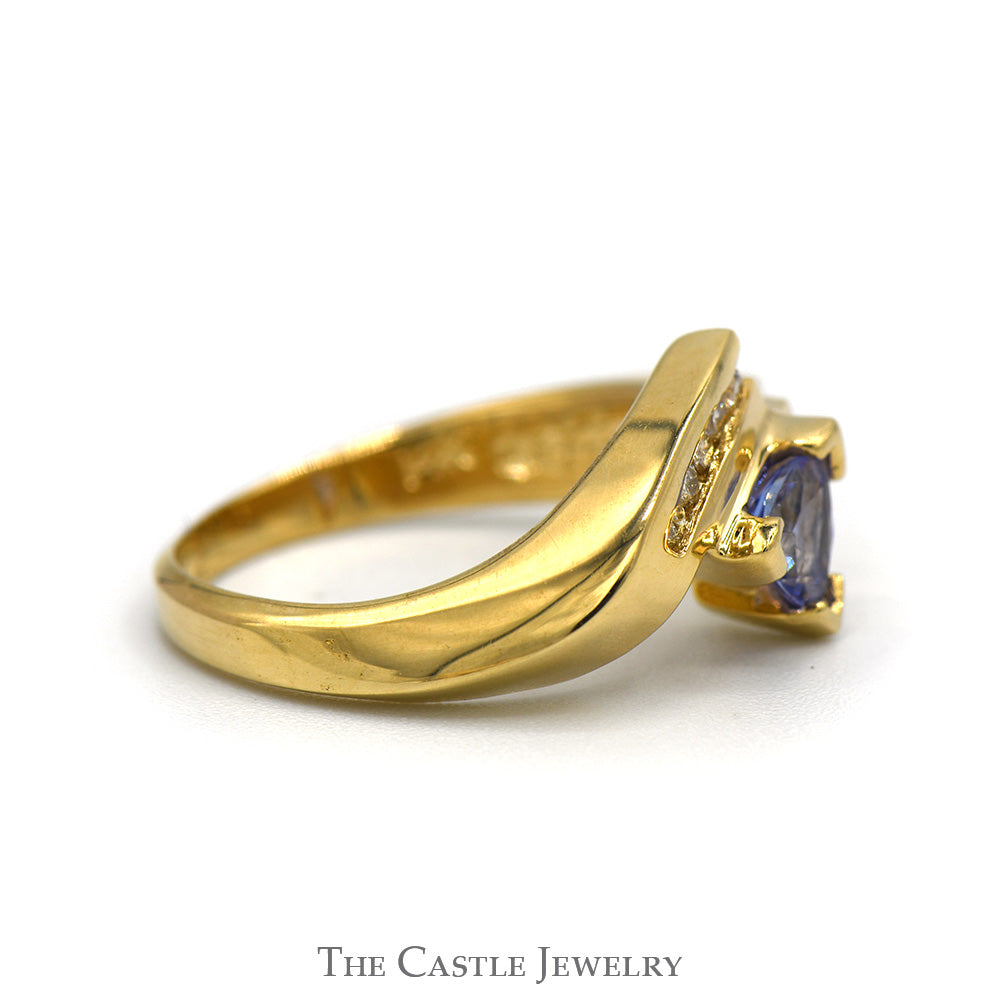 Trillion Cut Tanzanite Ring with Channel Set Diamond Accents in 14k Yellow Gold Bypass Mounting