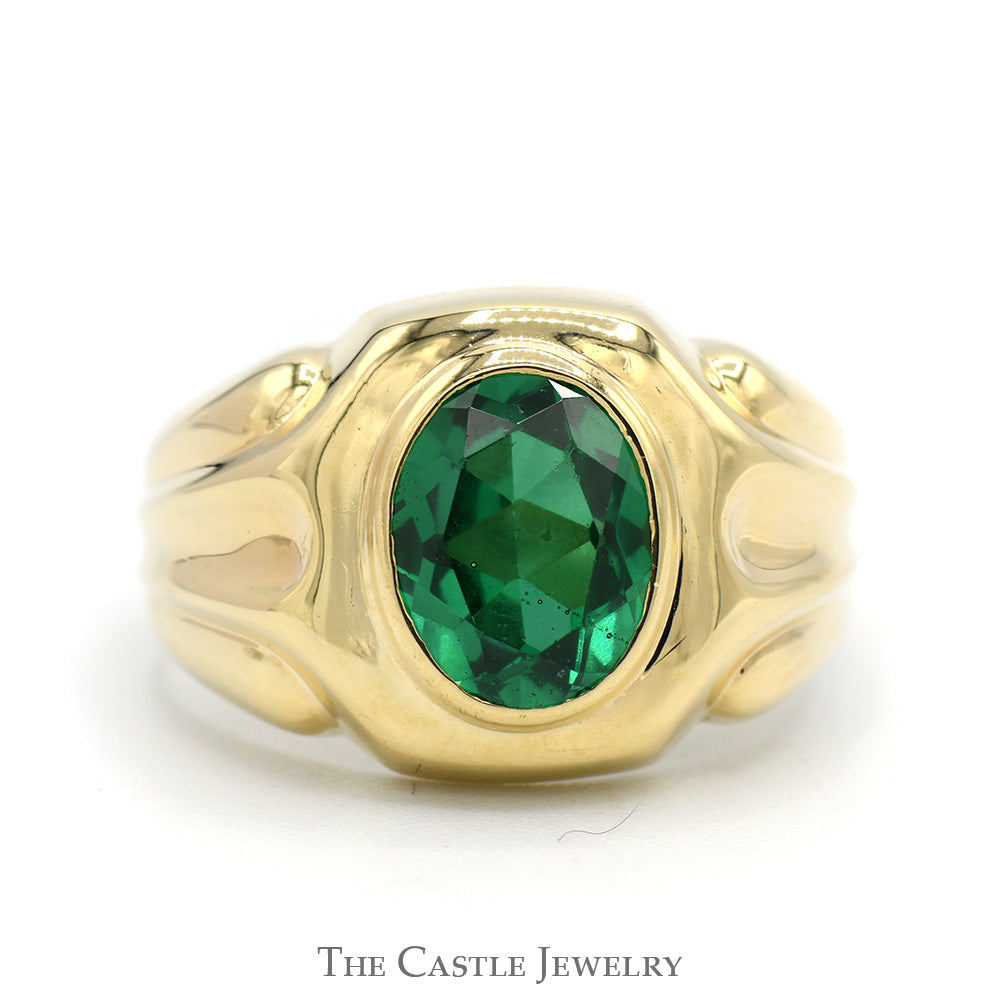 Oval Bezel Set Synthetic Emerald Ring with Concaved Grooved Sides in 10k Yellow Gold