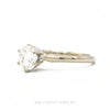 Side profile of the 14k white gold diamond solitaire ring showing prong head height and tapered shank - Thumbnail 2
